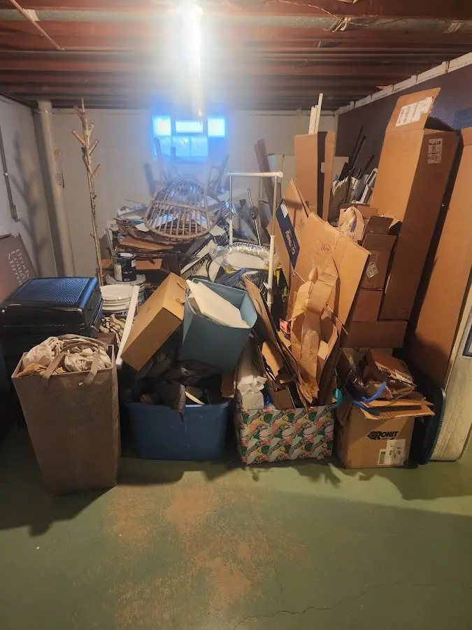 Roll-off dumpster container at job site for 2 Yard Dumpster Rental in Lansing